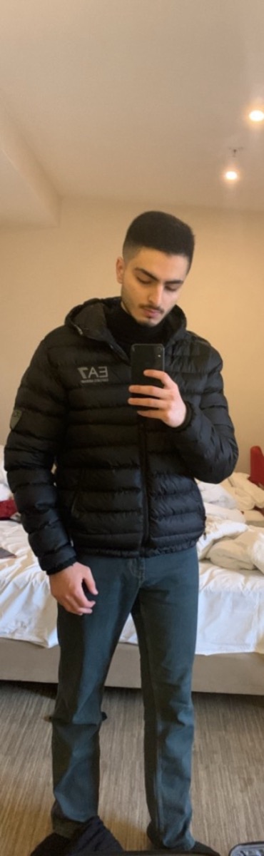 Zaid in a hotel room