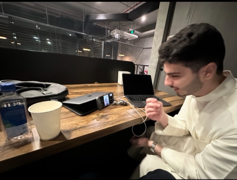 Zaid working at a desk